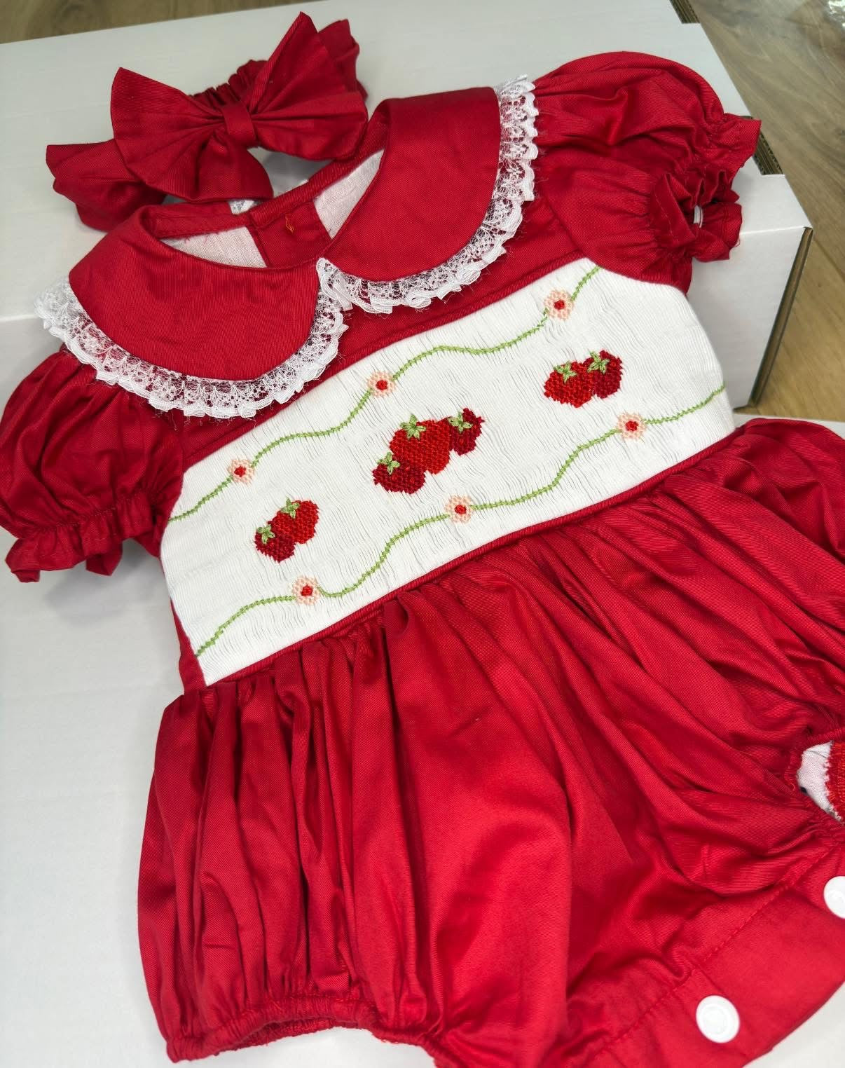 STRAWBERRY SWIRL HAND SMOCKED ROMPER